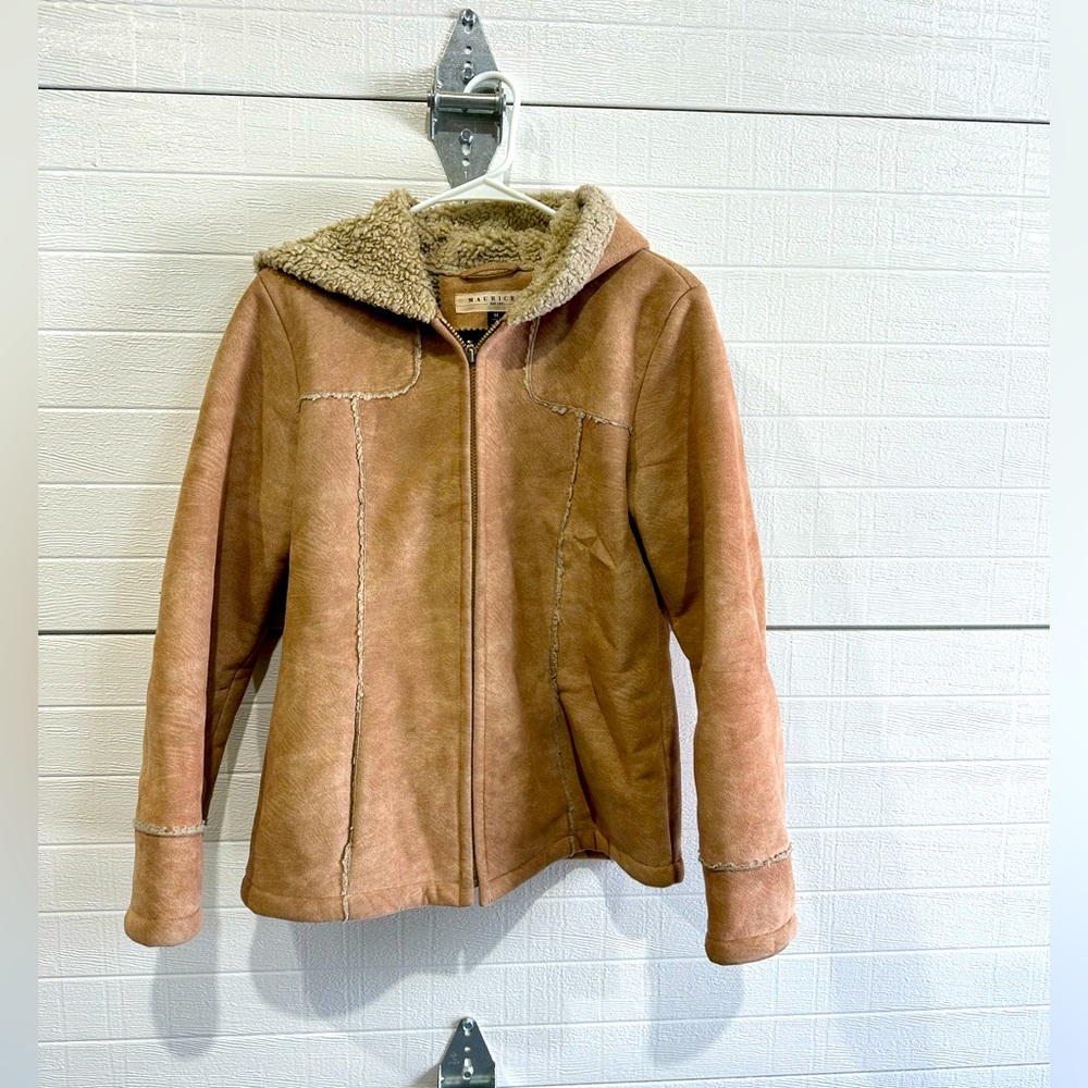 Warm coat. Cute. Suede-like feel. Coat is mostly polyester. Tan. Medium.